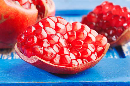 Pomegranate fruits on wooden background