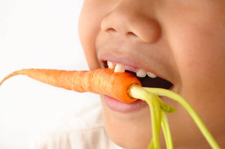 bite baby carrotの写真素材