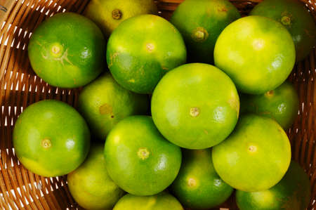 green lime in basketの写真素材