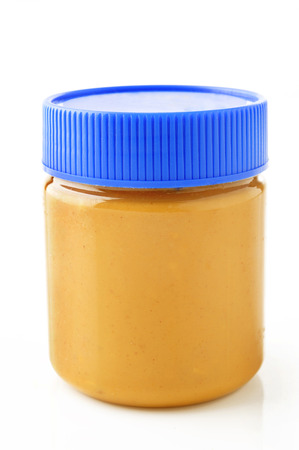 Jar of peanut butter  on a white の写真素材