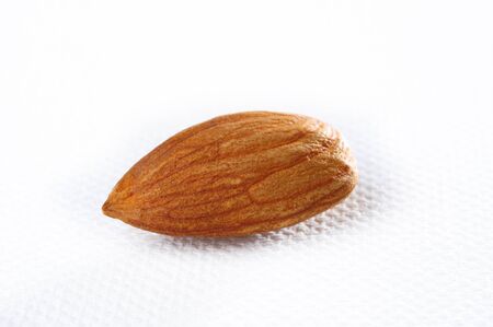 almonds on a white backgroundの写真素材