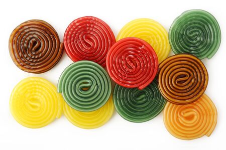 colorful liquorice licorice spiral candies on white backgroundの写真素材