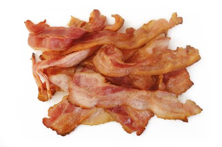 Cooked bacon rashers on white backgroundの写真素材