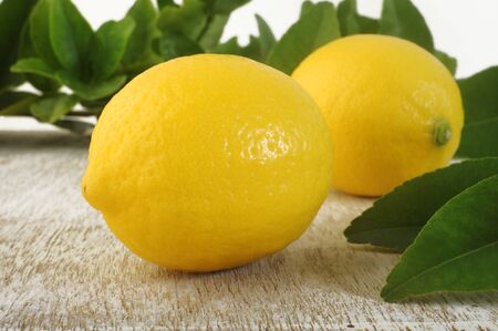 Fresh lemon on wooden backgroundの写真素材