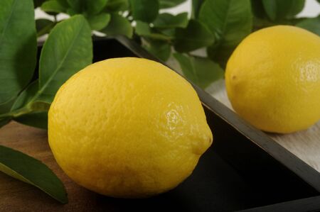 Fresh lemon on wooden backgroundの写真素材