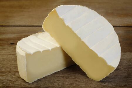 camembert cheese on wooden backgroundの写真素材
