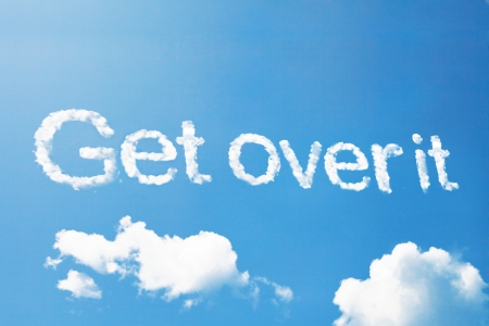 "get over it" a cloud message on skyの写真素材