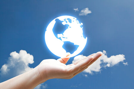 Hand vivid light earth on sky の写真素材