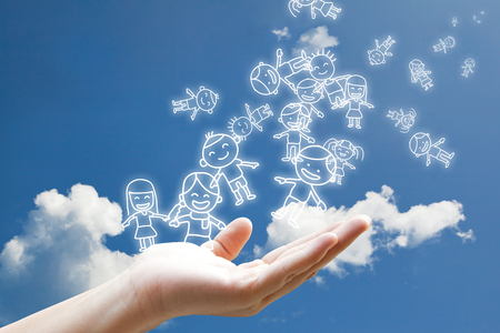 Children floating in to the skyの写真素材