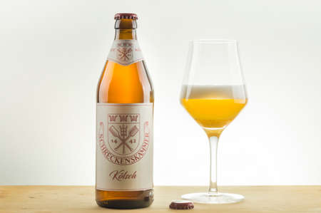 A bottle and a tasting glass of Schreckenskammer Koelsch Aleのeditorial素材