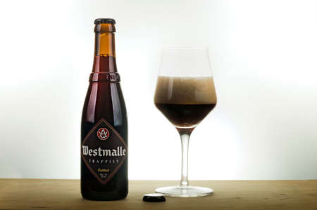 A bottle and a tasting glass of Westmalle Dubbelのeditorial素材