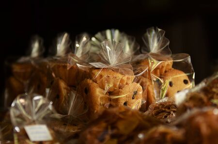 "Kanom Farang Kudeejeen" Thai local dessert cake in mix Chinese and Portuguese style, Crispy outside, black background, blurredの写真素材