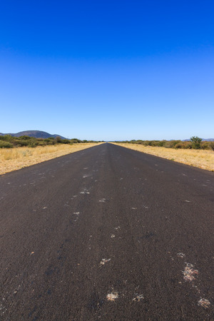 Empty tar road to nowhere Namibia Africa.の写真素材