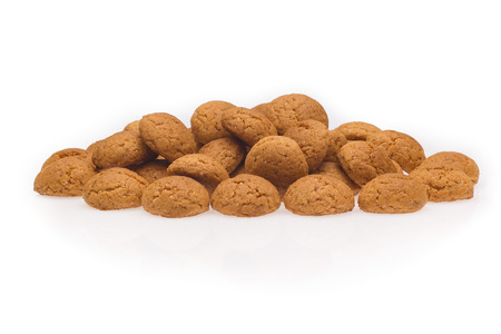Several pepernoten, a typical dutch treat for Sinterklaas on 5 december. Cookie isolated on white background, front view.の写真素材