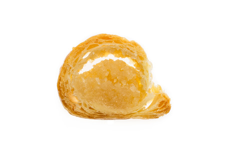 Bankstaaf small slice dutch delicacy isolated on white background. Filled with almond paste eaten around Sinterklaas celebration on 5 december. Event in Holland, Netherlands and Belgium.の写真素材
