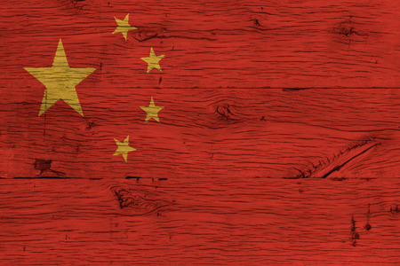 China, Chinese national flag painted on old oak wood. Painting is realistic and colorful on wood of old train carriage.の写真素材