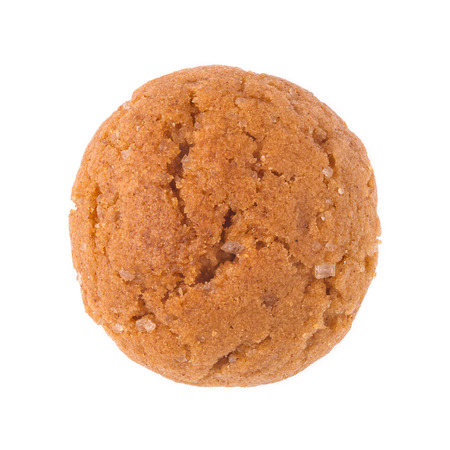 Single pepernoot close up. A traditional dutch treat for Sinterklaas on 5 december. Detailed cookie isolated on white background.の写真素材