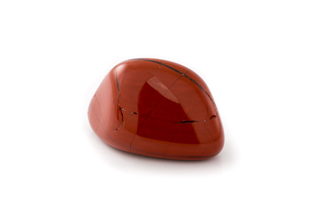 Red jasper gem on a white background.の写真素材
