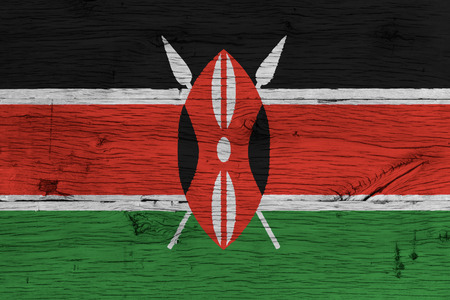 Kenya national flag painted on old oak wood. Painting is colorful on wood of old train carriage.の写真素材