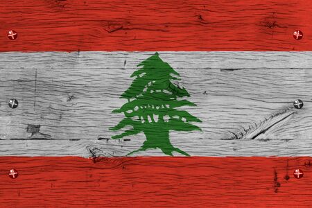 Lebanon, Lebanese national flag. Painting is colorful on wood of old train carriage. Fastened by screws or bolts.の写真素材