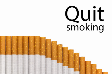 Quit smoking text with a graph of cigarettes, black text.の写真素材