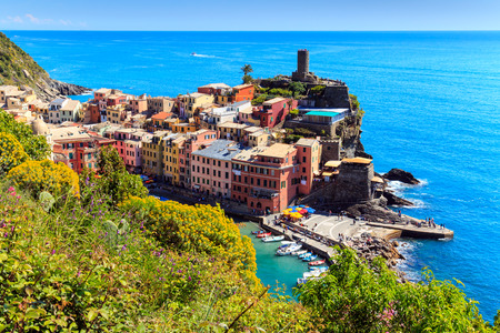 Vernazza famous fisherman village on steep Cinque Terre coast of Italy. Walking trail connects the...