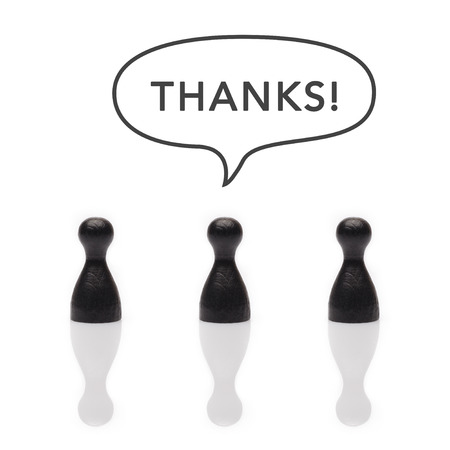 Black pawns say "thanks" with text balloon in black and whiteの写真素材