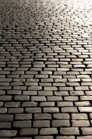 Endless old streets of coblled street in Italy Europe in evening sunの写真素材
