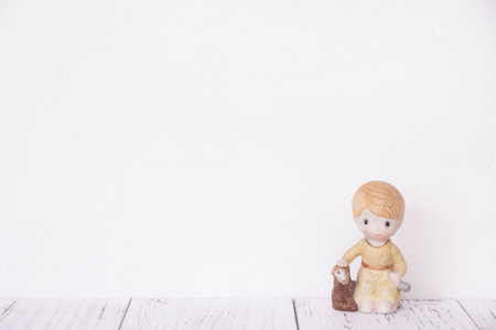 Stock photography retro white wall wooden vintage paint floor and ceramic doll toy boy sheepの写真素材