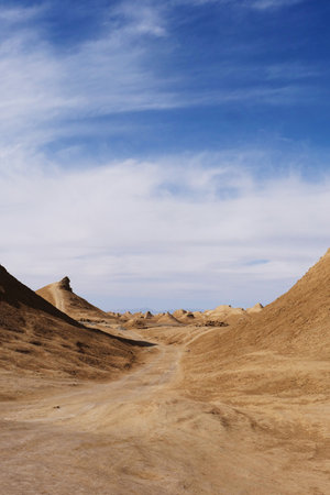 Beautiful landscape view of Yardang landform and sunny blue sky in Dunhuang Gansu Chinaの写真素材