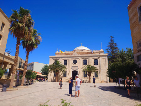 Historic Mediterranean Church Facade With Palm Trees in Heraklion Crete, Greece