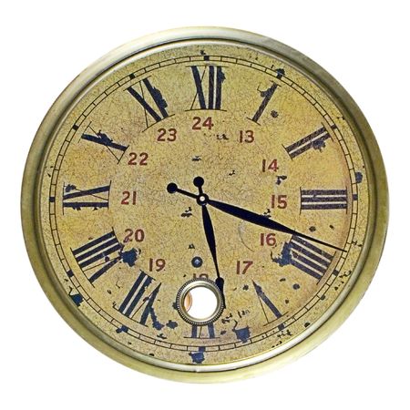 Face from a grunge clock isolated on white. Face is grungy with cracks and stains.