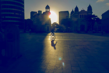 Cyclist against the light of the sunの写真素材