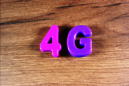 colored letters on wooden background