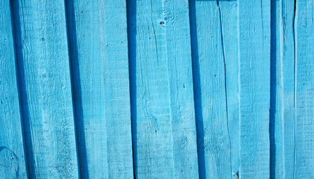 Cracked wooden wall surface close up, aquamarine color old shabby backgroundの写真素材