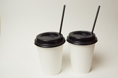 two glasses of takeaway coffee on a white backgroundの写真素材
