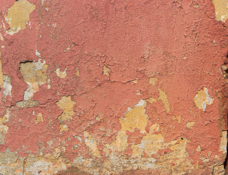 Background of peeling paint in red and yellowの写真素材