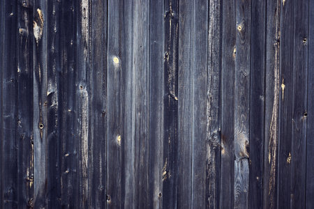 Dark gray wooden background dark gray wooden wall covering of a barn fence with a wide textureの写真素材