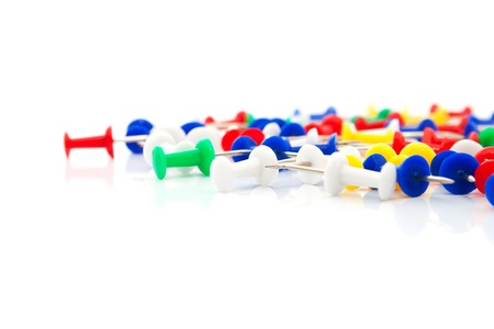 The numerous  push pins  on the white background