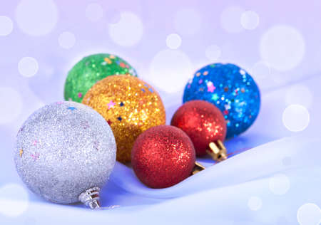 Christmas toys on the snowy background decorated with bokehの写真素材