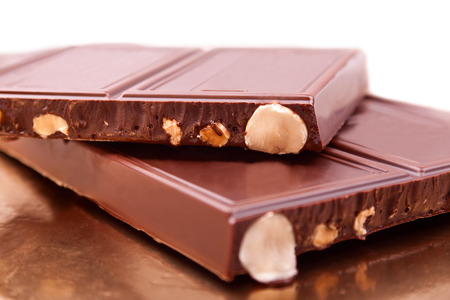 The peaces of delicious milk chocolate close-upの写真素材