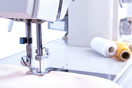 The sewing machine at the begining of work with the satin tissueの写真素材