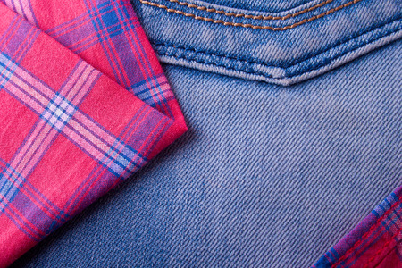Casual style background with jeans back and plaid shirtの写真素材