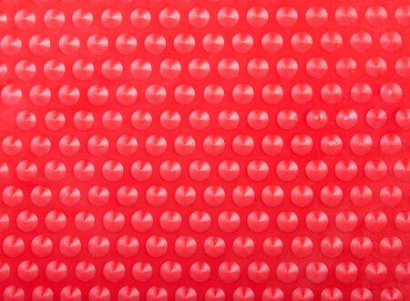 Plastic Red Background with Many Cone Round Dots Lighted as Radarの写真素材