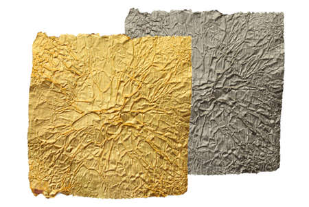 The gold foil and silver foil are on the white backgroundの写真素材