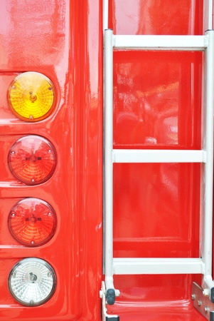 Bottom of fire engine ladder and electric light bulb