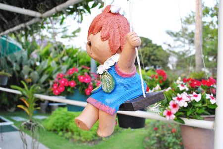 Home made ceramic doll is hang onの写真素材