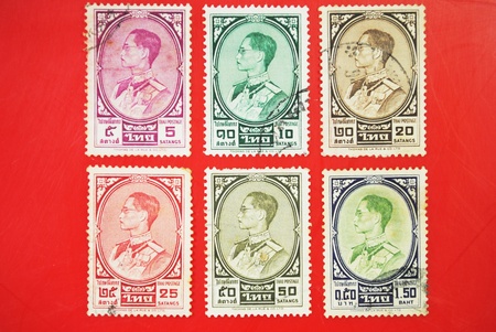 THAILAND - CIRCA 1950: A stamp printed in USA shows image portrait Bhumibol Adulyadej (Royal Institute: Phumiphon Adunyadet born 5 December 1927) is the current King of Thailand, circa 1950. の写真素材
