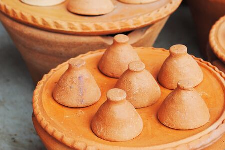 Pile of clay tangine cooking pottery in marketの写真素材