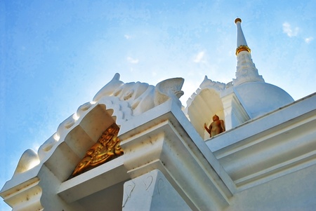 The beautiful white pagoda in thailand with sunshineの写真素材
